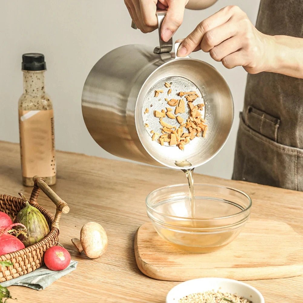 Lenzie frying pot with black handle and stainless steel body, suitable for stovetop cooking and frying tasks.
